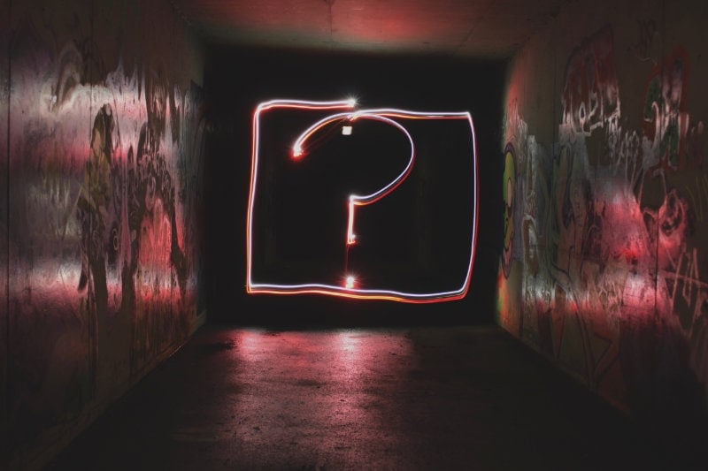 a neon question mark sign