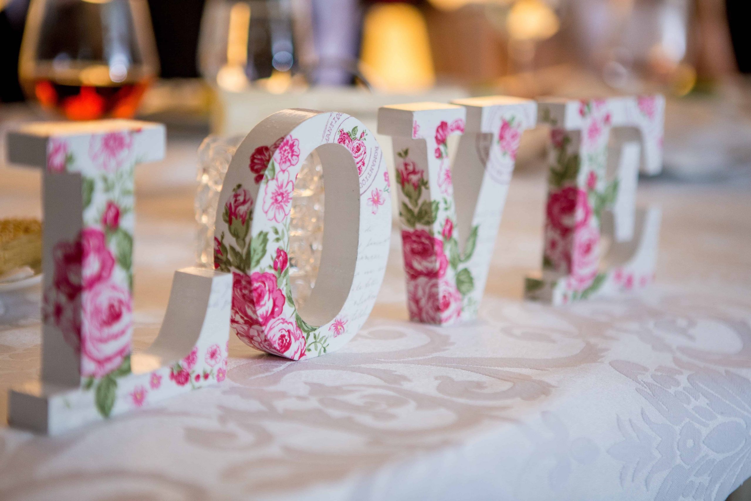 Letter Blocks Making Up the Word "L-O-V-E" at a wedding reception desk