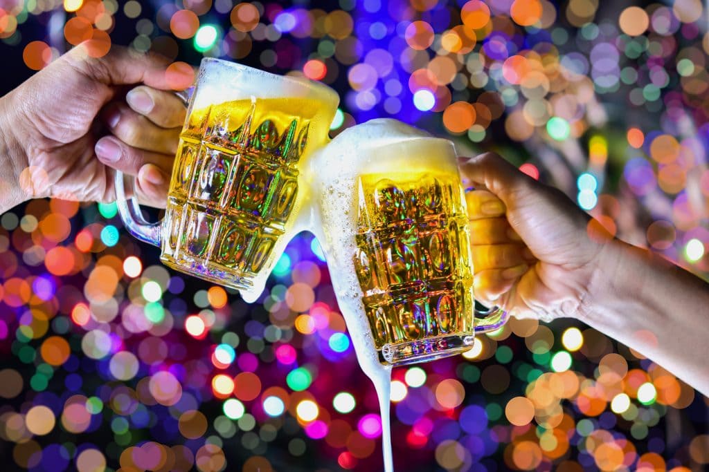 Celebration with a beer mug background bokeh is a concept of celebration and social gatherings.
