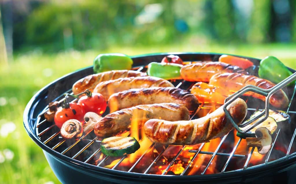 Grilled sausage on the picnic flaming grill