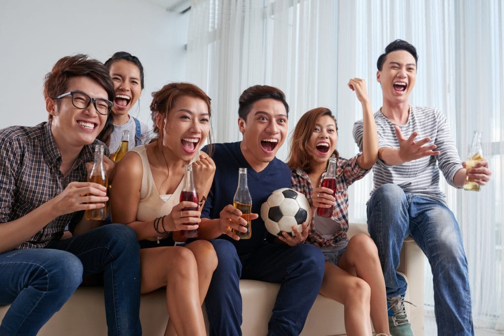 a group of friends watching soccer match together